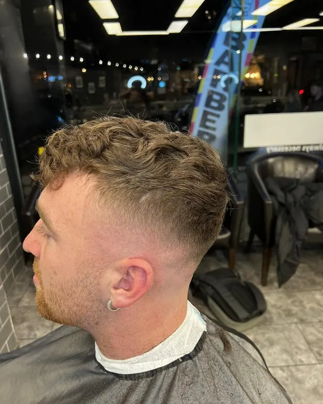 A textured crop with a skin fade, side view
