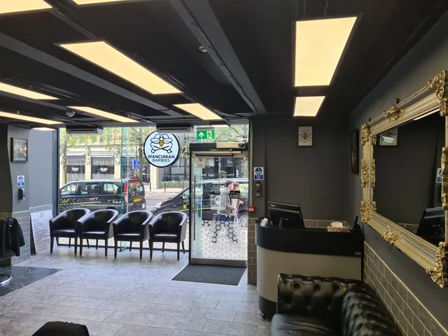 The waiting seats and the front door, seen from inside the shop