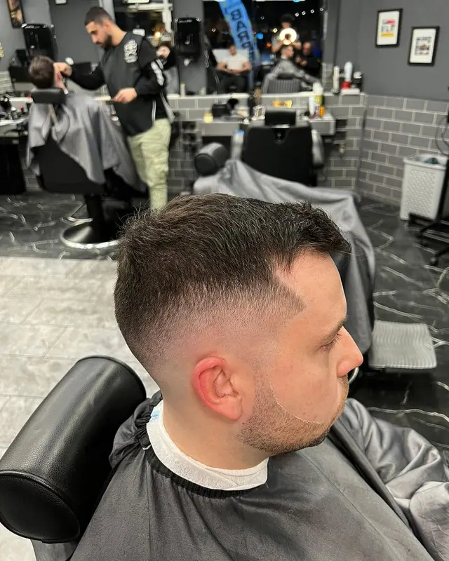 A short textured cut with a low fade
